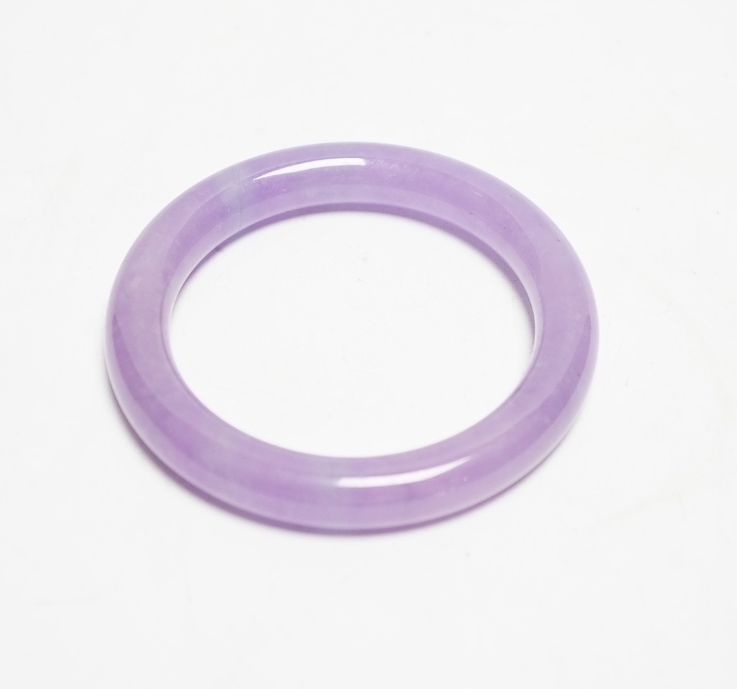 A Chinese lavender hardstone bangle